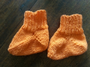 Pattern: Baby Socks Designer: Marie Connolly Book: The Expectant Knitter Yarn: Knit Picks Palette in Apricot